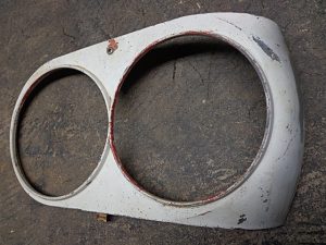 1958 Ford Thunderbird LH headlight bezel door