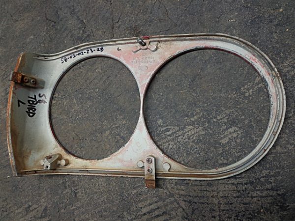 1958 Ford Thunderbird LH headlight bezel door