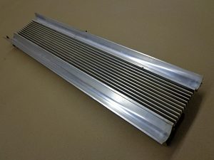 1965 Cadillac LH rear bumper grille filler panel