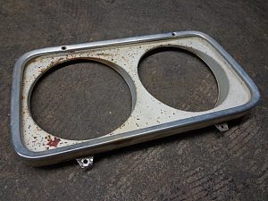 1965 Ford Fairlane headlight door bezel assembly