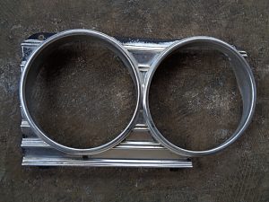 1966 Chevrolet Impala LH headlight bezel OEM