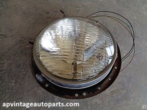 1956 Cadillac headlight bucket and parts