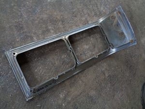 1976 Oldsmobile Delta 88 headlight door bezel