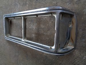 1976 Oldsmobile Delta 88 headlight door bezel