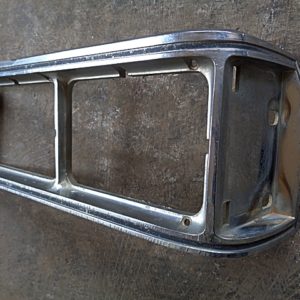 1976 Oldsmobile Delta 88 headlight door bezel